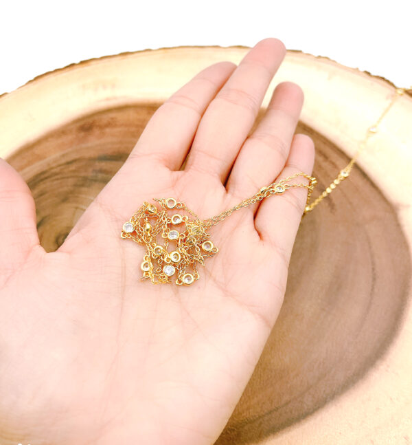 Hand Holding Gold Filled Chain Round